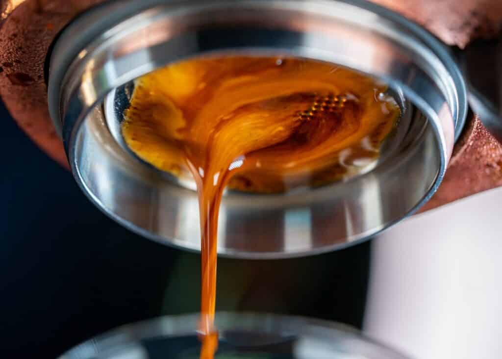 coffee dripping from lever espresso machine