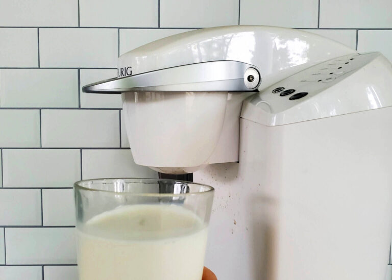 glass of milk in front of keurig