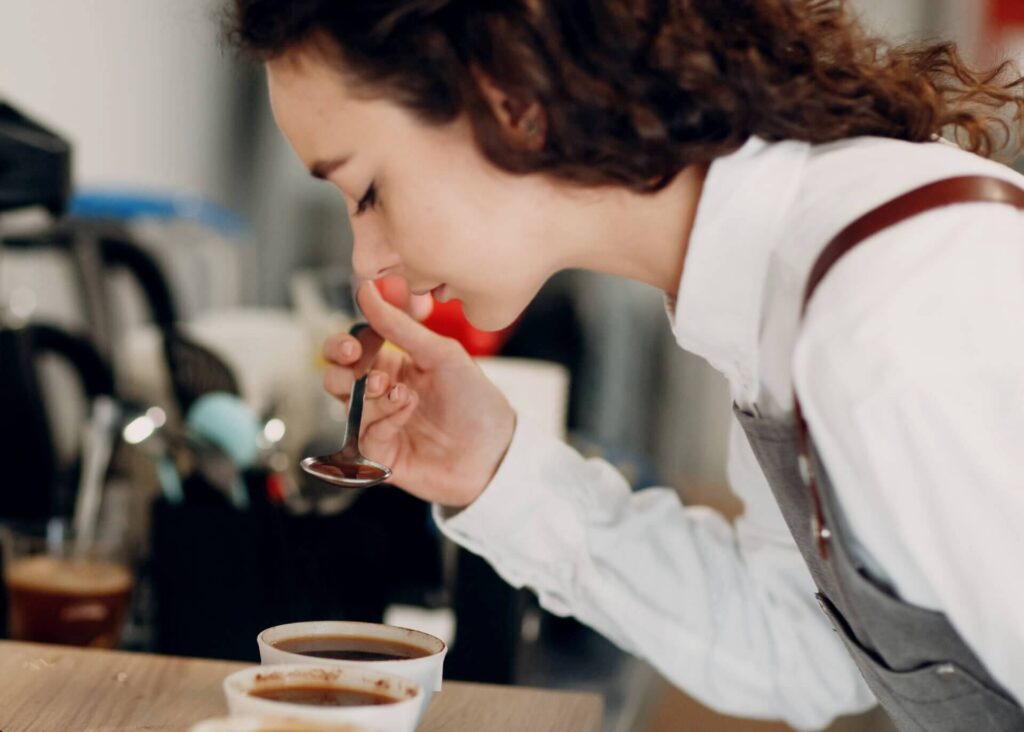 woman doing coffee cup tasting