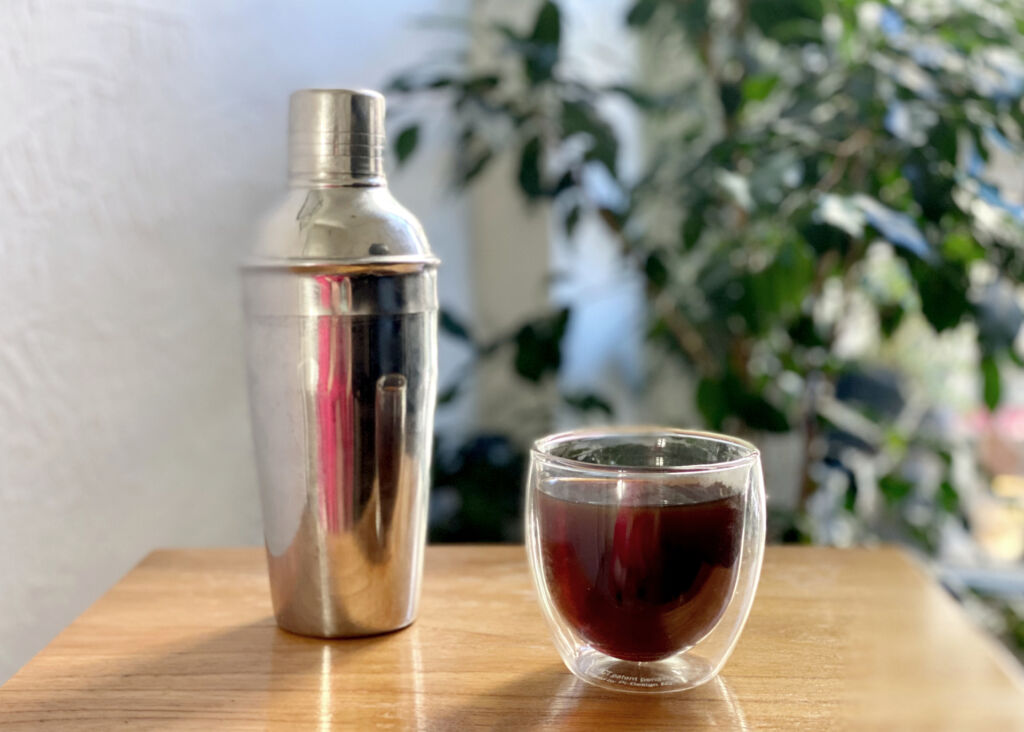 cocktail shaker and coffee cup