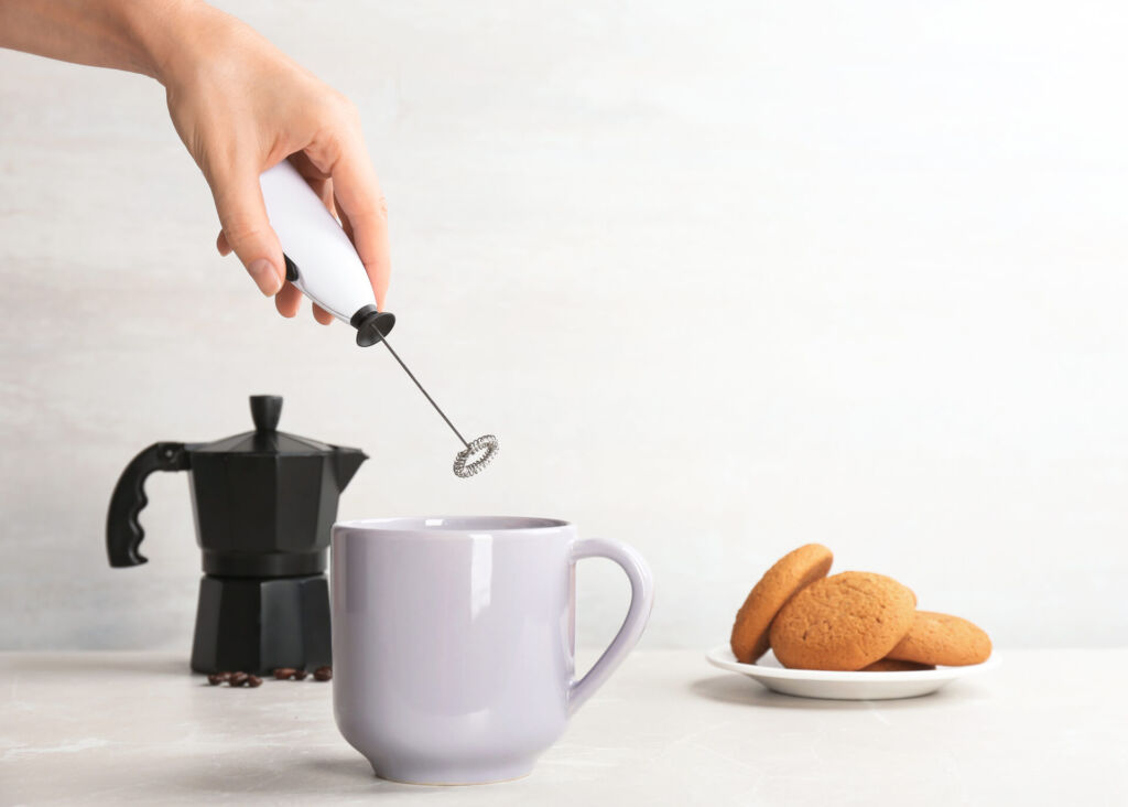 frothing milk with handheld milk frother