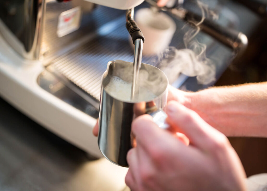 steaming milk with coffee machine