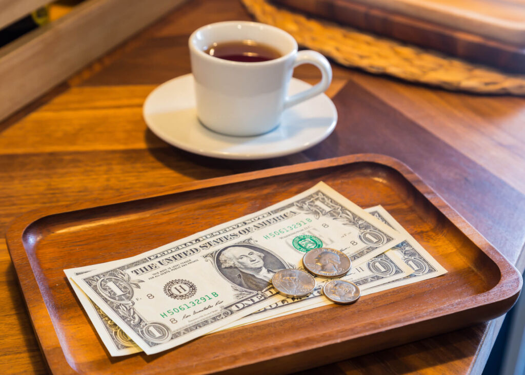 coffee cup and money on the table