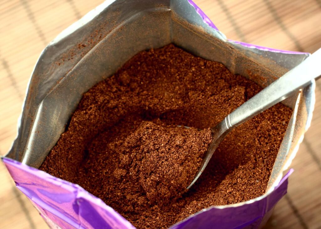 ground coffee in a bag with spoon
