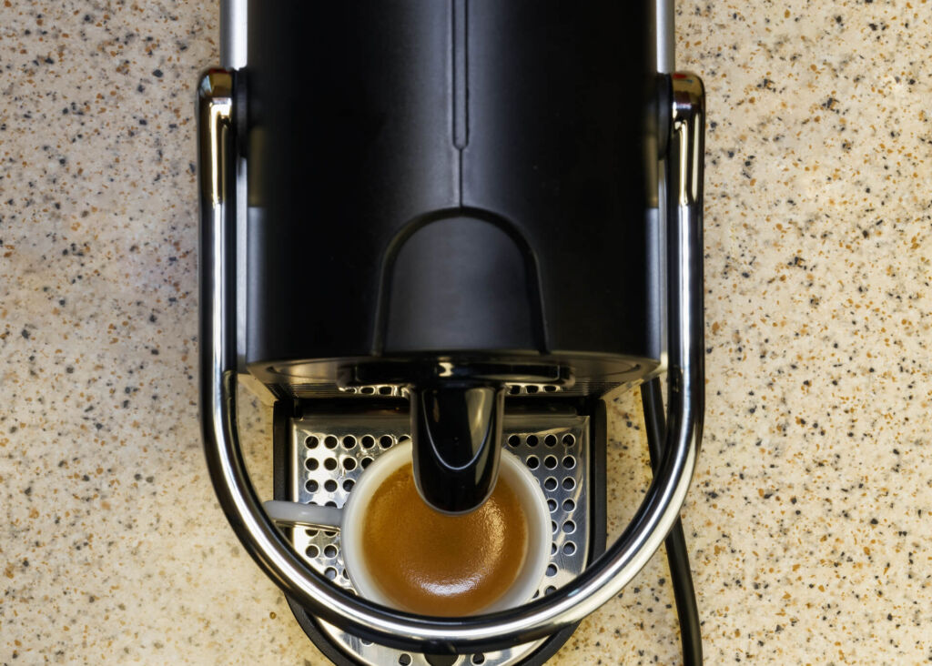 nespresso machine brewing coffee