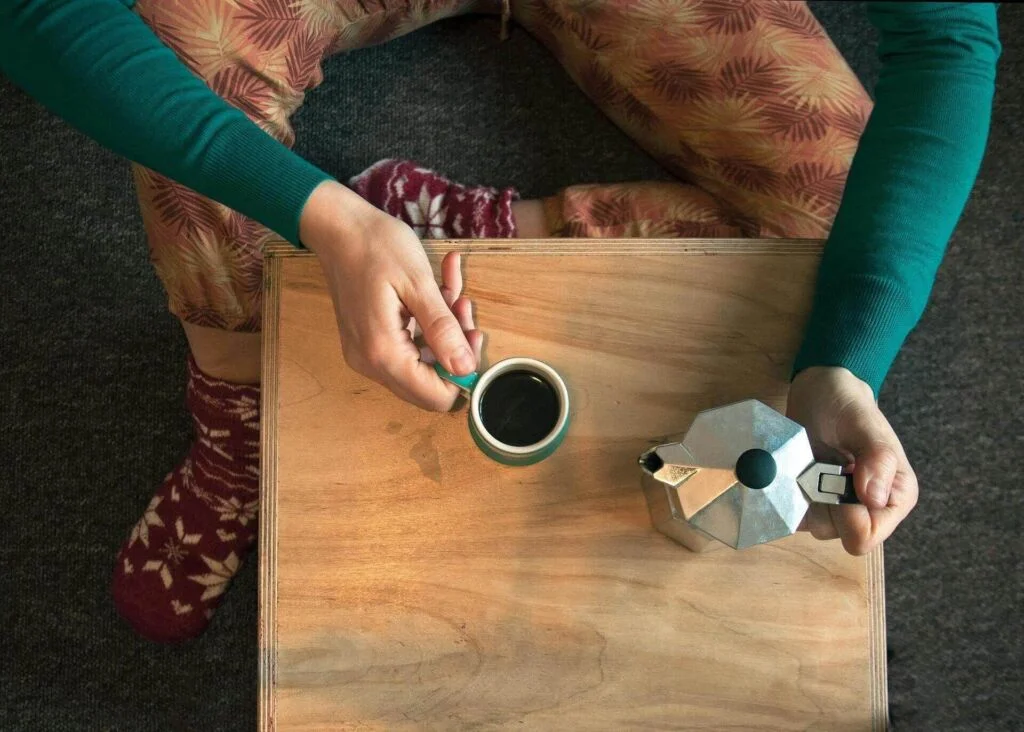 woman drinking moka pot coffee