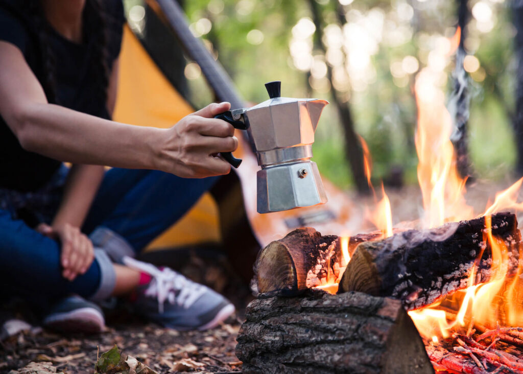 brewing moka pot coffee on campfire