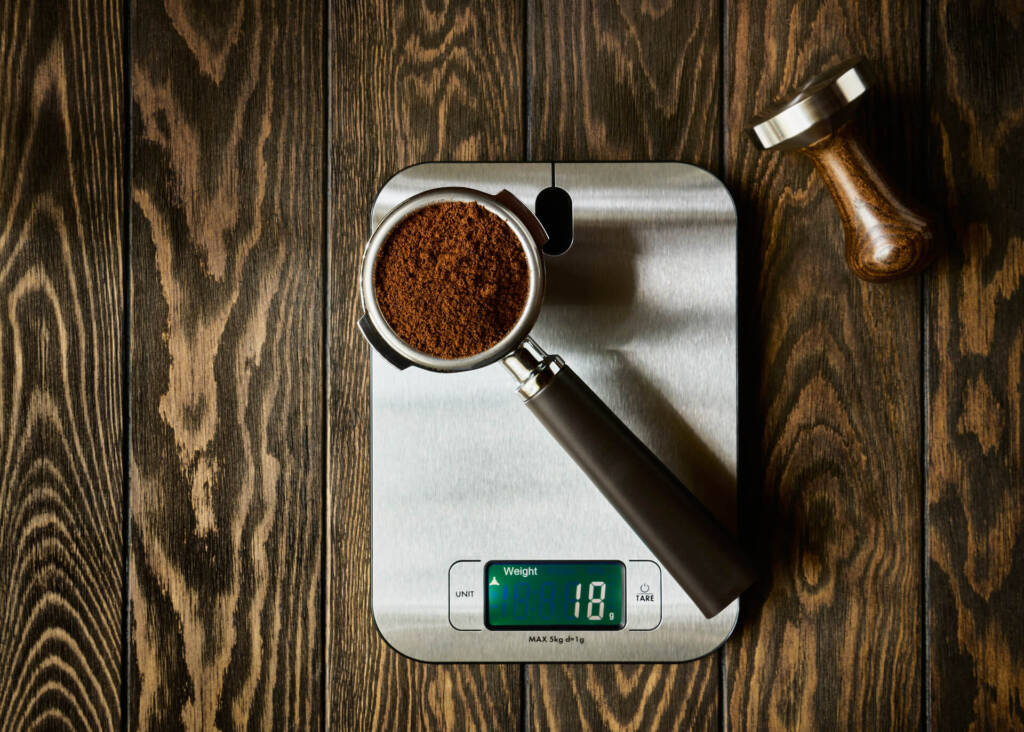 weighing ground coffee in portafilter