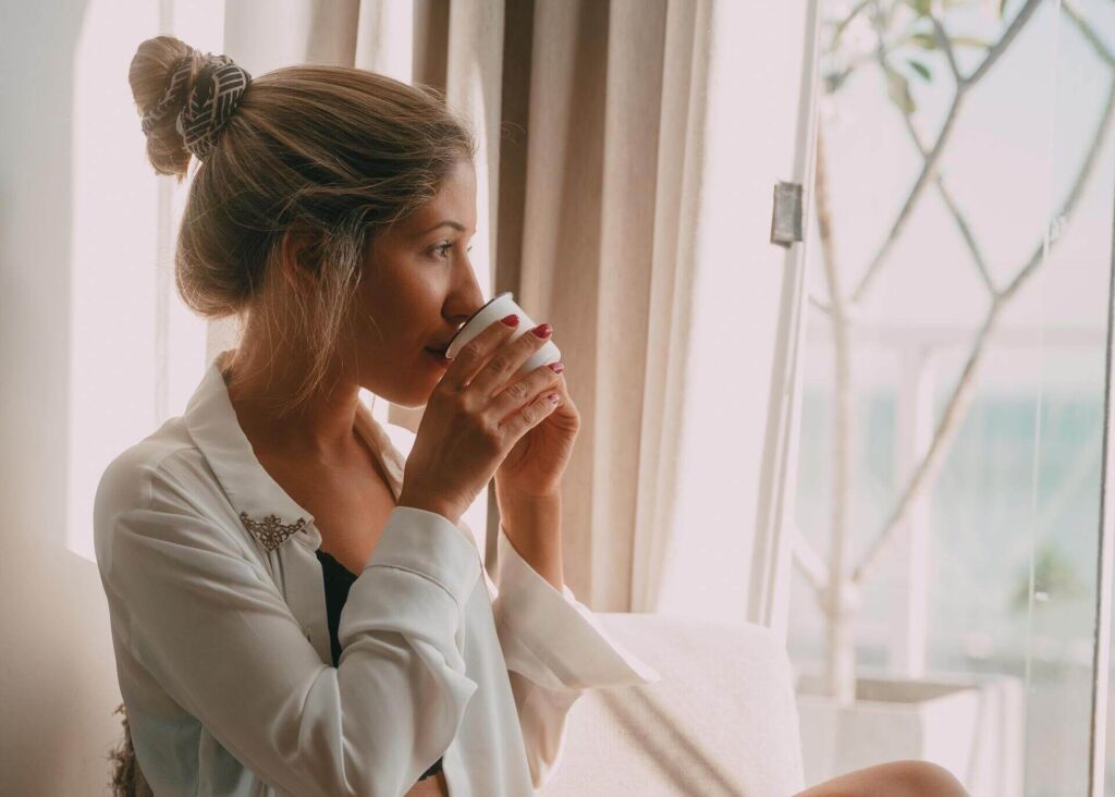 woman drinking espresso in the morning