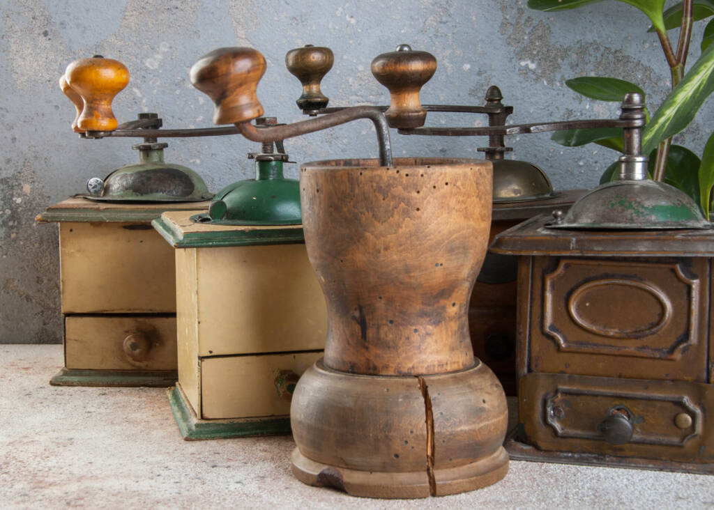 different wooden and metal antique coffee grinders