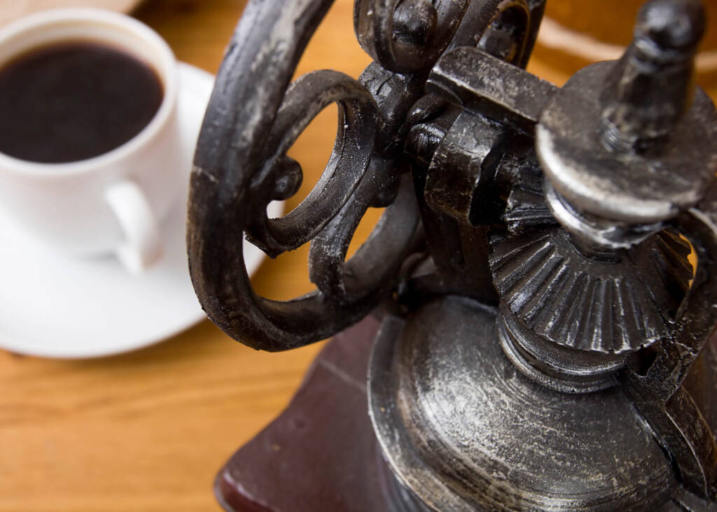 metal detail of antique coffee grinder