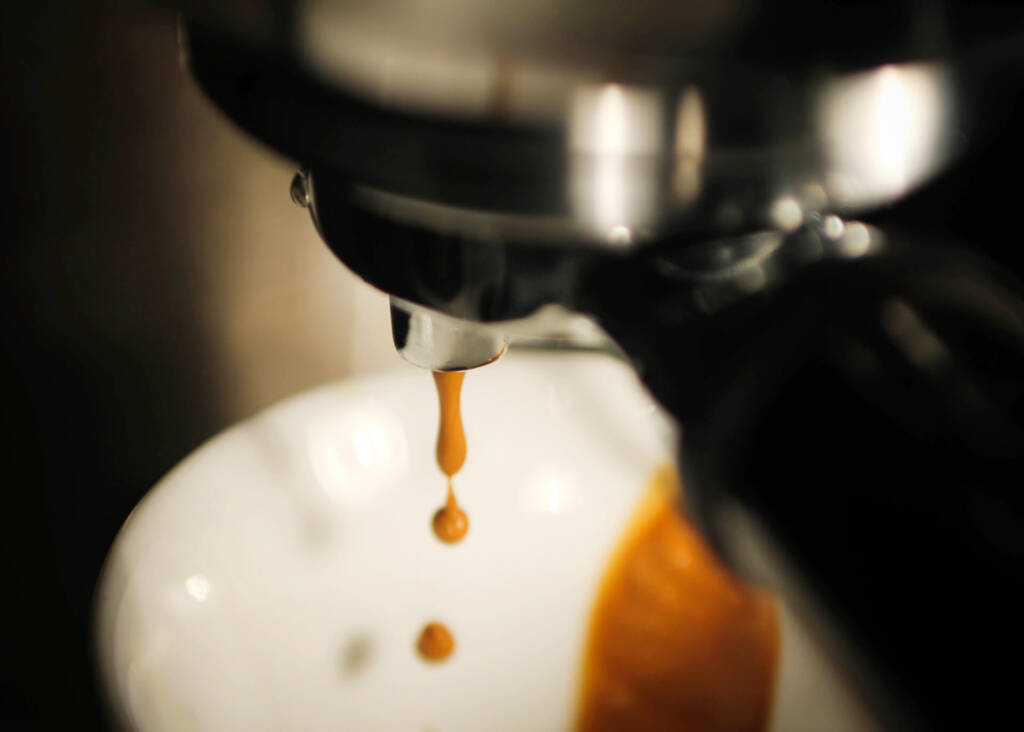 espresso dripping into a cup
