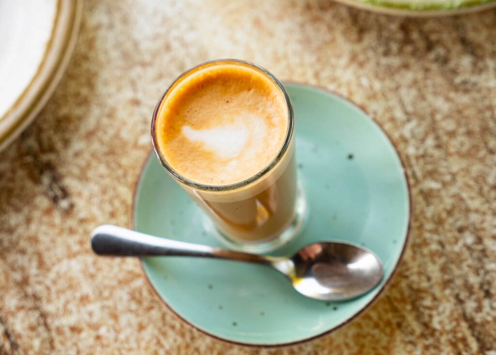 top view of cortado glass on a saucer